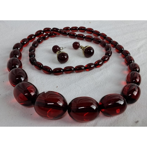 359 - Ruby bead necklace and matching earrings.