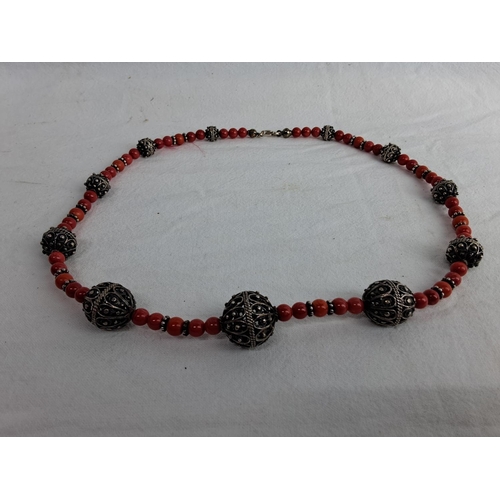 365 - A stunning antique/ vintage coral necklace with decorative white metal beads.