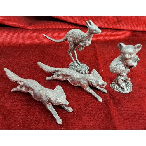 372 - A collection of miniature metal animals to include foxes, a kangaroo & Koala bear.