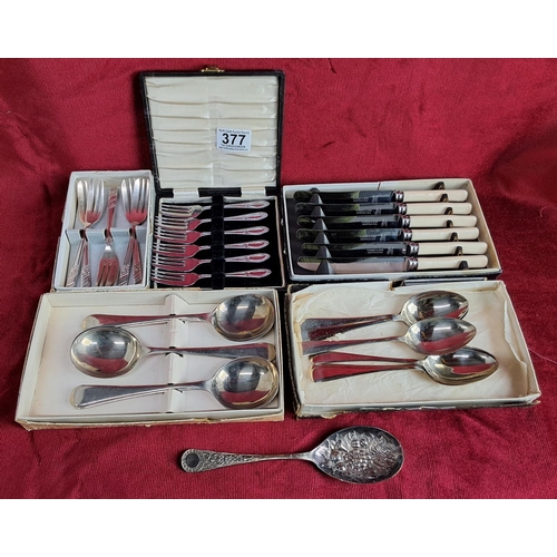 377 - An assortment of cased cutlery.