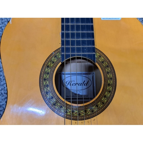 435 - A vintage Herald acoustic guitar.