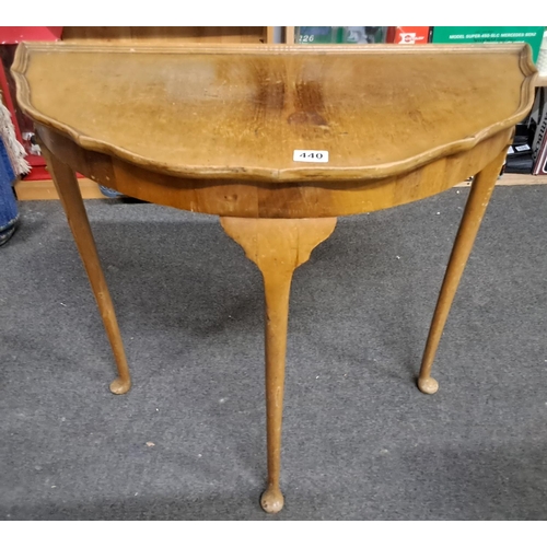 440 - A vintage Demi Lune table.