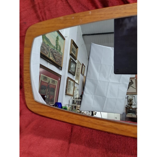 449 - A vintage/ retro mirror. Measuring 75x28cm.