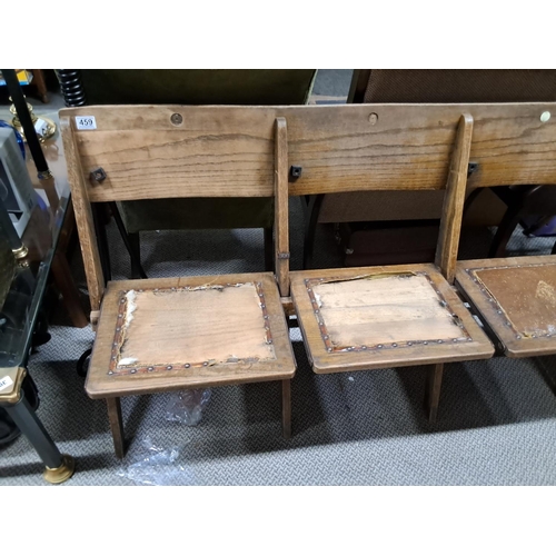 459 - A vintage folding wooden theatre bench.