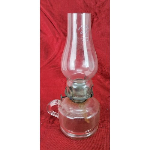 461 - An antique clear glass oil lamp.