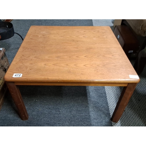 472 - A vintage wooden coffee table.