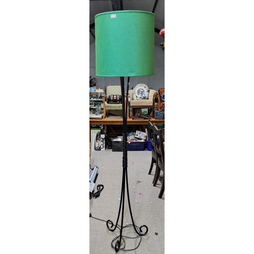 473 - A handmade wrought iron standard lamp with shade.