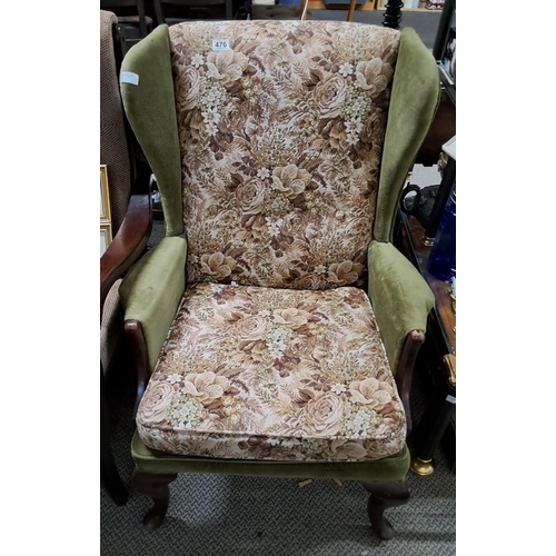 476 - A vintage Parker Knoll wingback armchair.