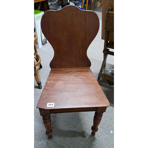 484 - An antique mahogany shield back chair.