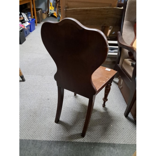 484 - An antique mahogany shield back chair.