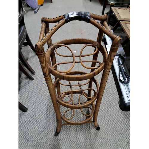 486 - A vintage rattan 3 tier plant stand.