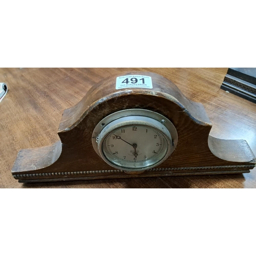 491 - A vintage wood cased Smiths car clock.