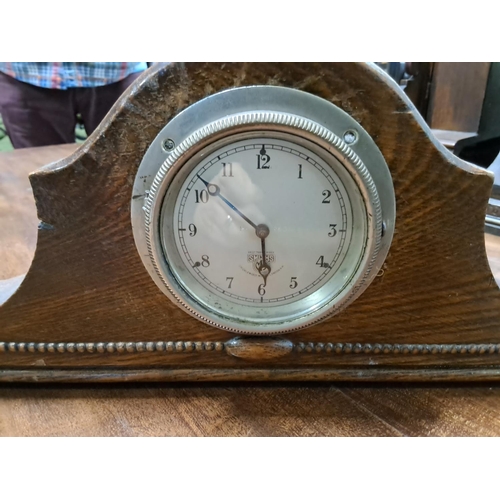 491 - A vintage wood cased Smiths car clock.