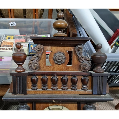 493 - A decorative antique wood cased wall clock.