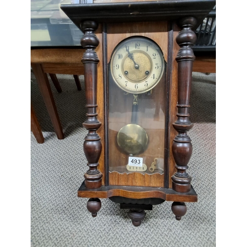 493 - A decorative antique wood cased wall clock.