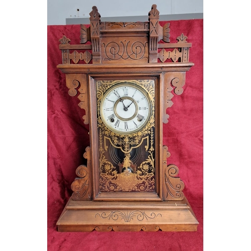 497 - An antique Gingerbread/ schoolhouse clock.