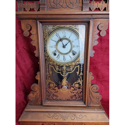 497 - An antique Gingerbread/ schoolhouse clock.