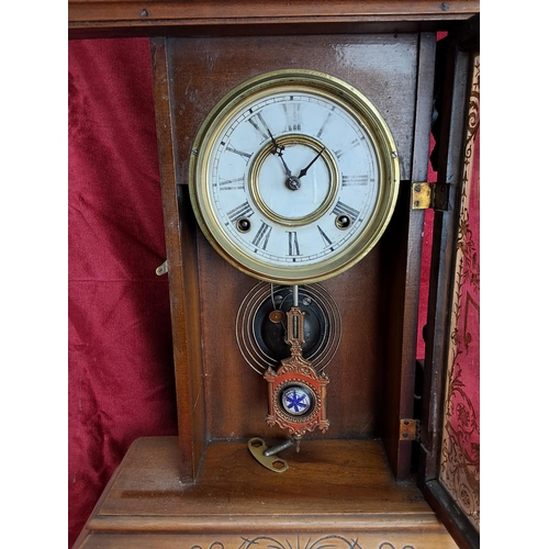 497 - An antique Gingerbread/ schoolhouse clock.