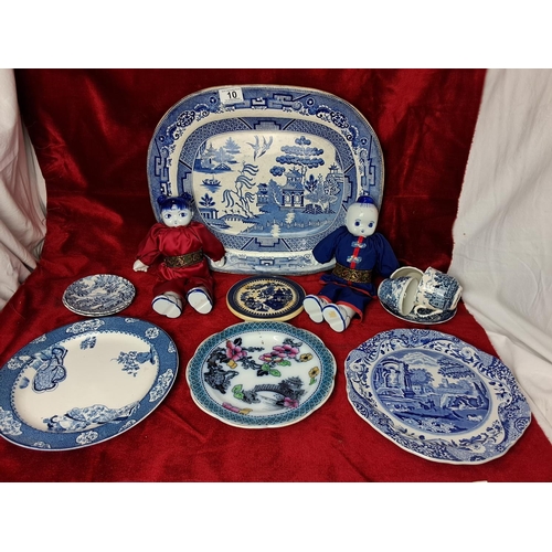 10 - An assortment of decorative blue & white ceramics, to include a pair of dolls & more.