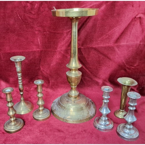 19 - A collection of vintage brass candlesticks & a brass plant stand.