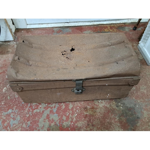 3 - An antique tin trunk.