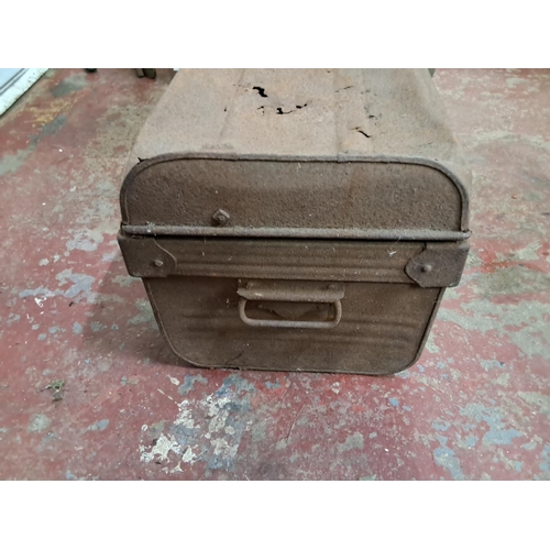 3 - An antique tin trunk.