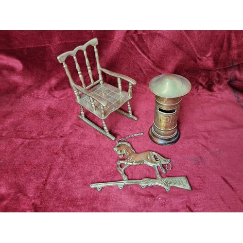 31 - An assortment of vintage brassware, to include Post box money box (13.5cm), rocking chair (17cm)& ho... 