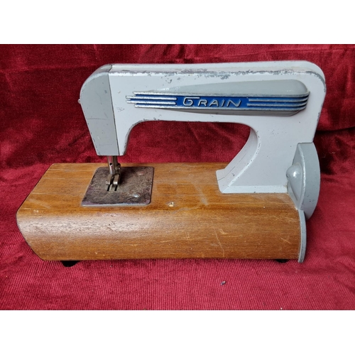 33 - A vintage Grain child's sewing machine.