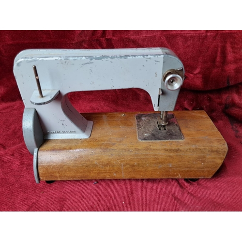 33 - A vintage Grain child's sewing machine.