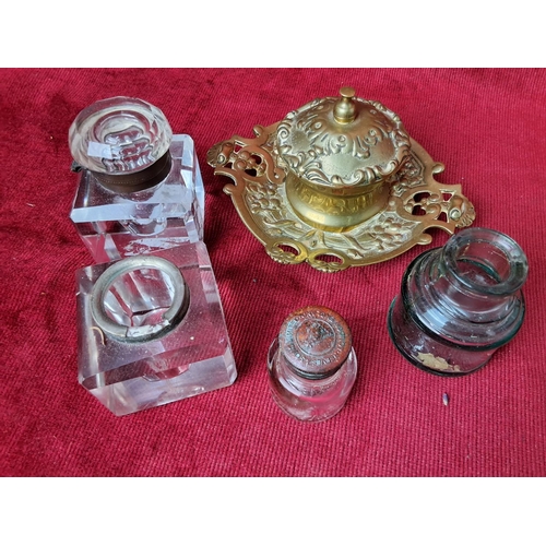 35 - A collection of antique inkwells & bottles.