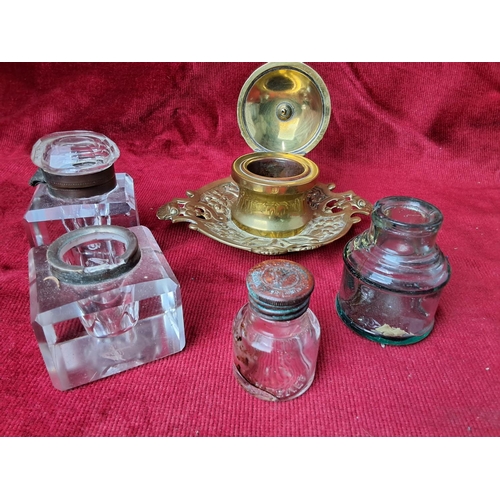 35 - A collection of antique inkwells & bottles.