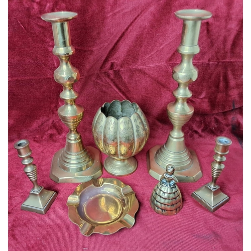 38 - An assortment of brassware to include candlesticks & more.