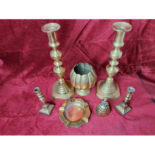 38 - An assortment of brassware to include candlesticks & more.