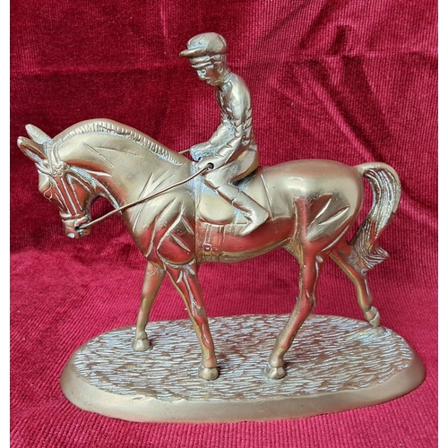 41 - A vintage brass horse & jockey figure. Measuring approx 15cm in height.