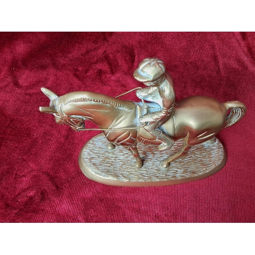 41 - A vintage brass horse & jockey figure. Measuring approx 15cm in height.