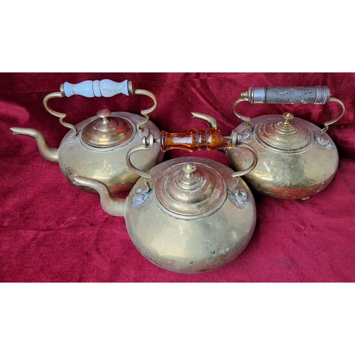 45 - A collection of 3 vintage brass kettles.