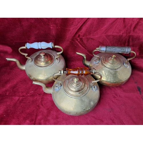 45 - A collection of 3 vintage brass kettles.