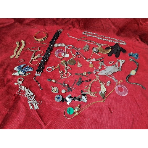 63 - An assortment of vintage costume jewellery etc.