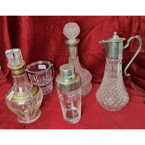 9 - An assortment of glassware to include decanters, a carafe & more.