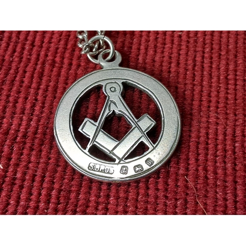 96 - A vintage Sterling Silver hand engraved Masonic pendant on chain. Weighing 13.50 grams.