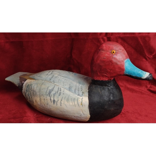 114 - A hand carved & painted duck decoy, signed to base.