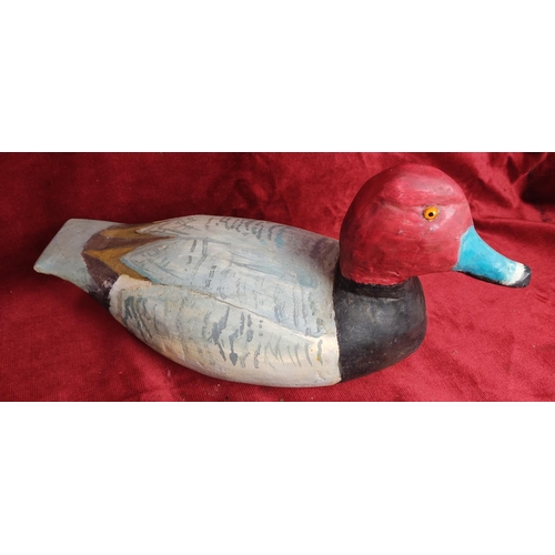 114 - A hand carved & painted duck decoy, signed to base.