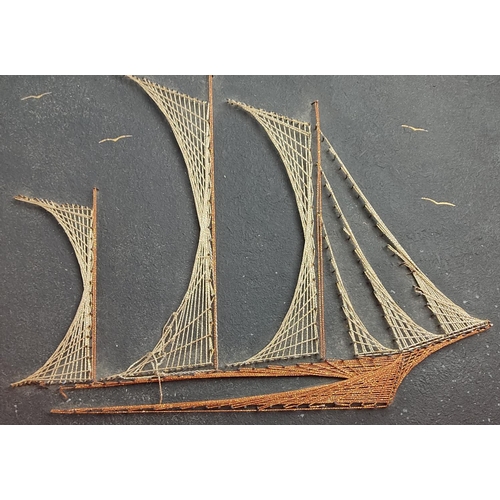 138 - A vintage/ Mid Century string art ship. Measuring 50cm x 41cm.