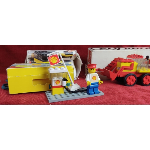 141 - Three vintage lego sets to include a Service Station and two diggers, numbers 601, 604 and 642.