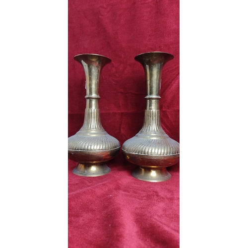 185 - A pair of large vintage decorative brass vases, each measuring approx 27cm.