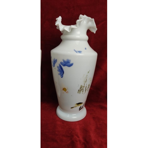 191 - A pair of antique hand painted milk glass vases with uranium glaze, each measuring approx 18 cm tall... 