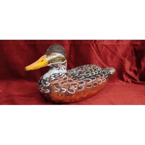 115 - A hand carved & painted duck decoy, signed to base.