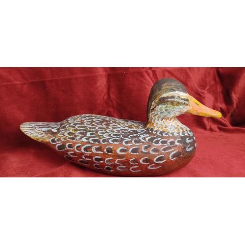 115 - A hand carved & painted duck decoy, signed to base.