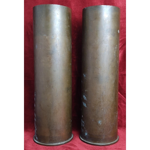 130 - A pair of large antique/ vintage brass shell casings, each measuring 37cm tall.