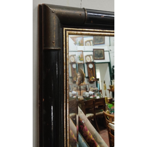 133 - A large antique style mirror with wood frame & bevelled glass. Measuring approx 101cm x 51cm.